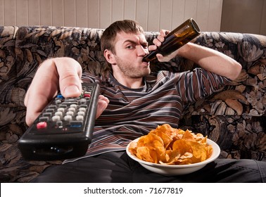 man-beer-chips-watching-tv-260nw-71677819.jpg